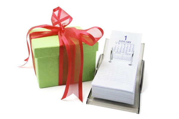 Geschenk box en bureau kalender — Stockfoto