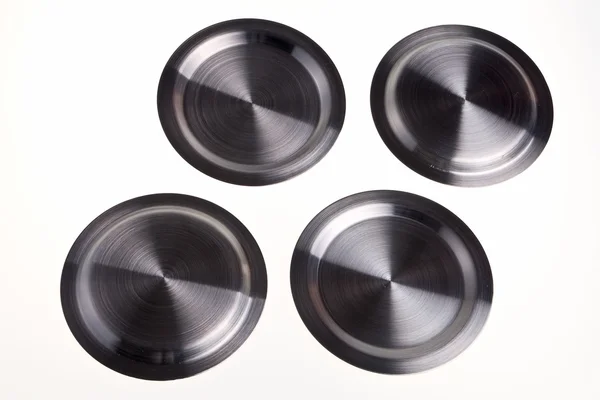 A steel saucers in a pattern. — Stock Photo, Image
