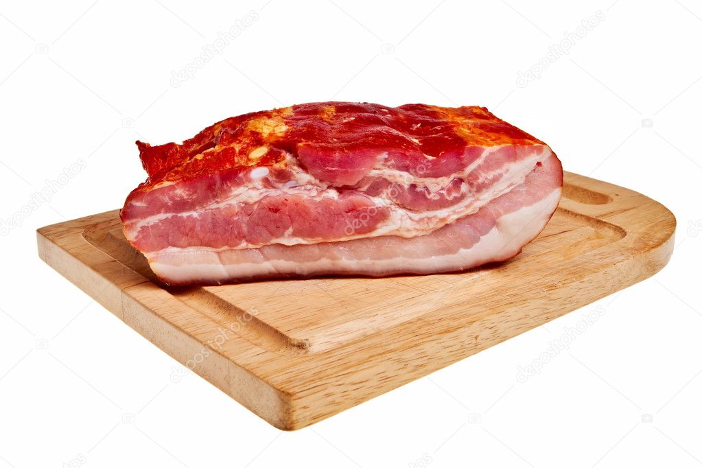 Smoked bacon on wooden board.
