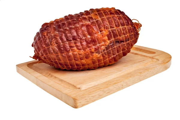 Grote smakelijke gerookte ham aan boord. — Stockfoto