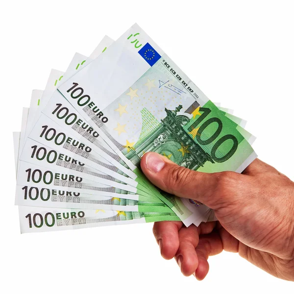 Banconote da 100 euro detenute da un maschio destro . Immagini Stock Royalty Free