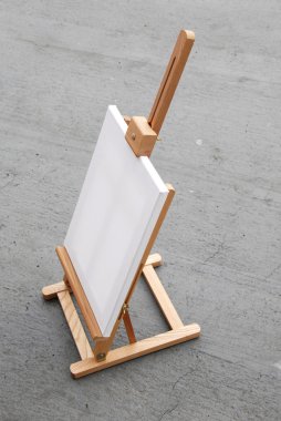 Easel with blank canvas clipart