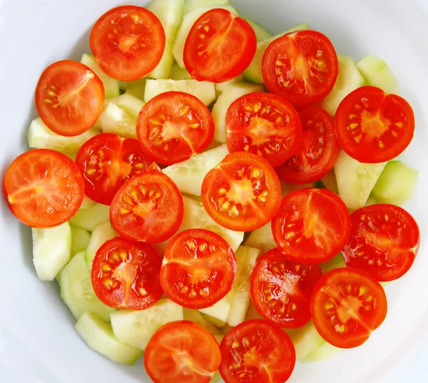 Cherry tomatoes and cucumber salad — Stock Photo, Image