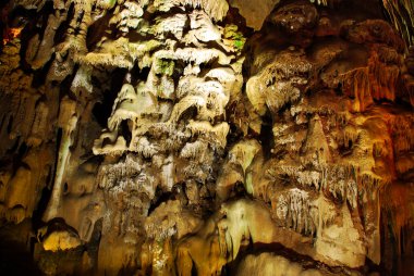 Stalagmites in stone cave clipart