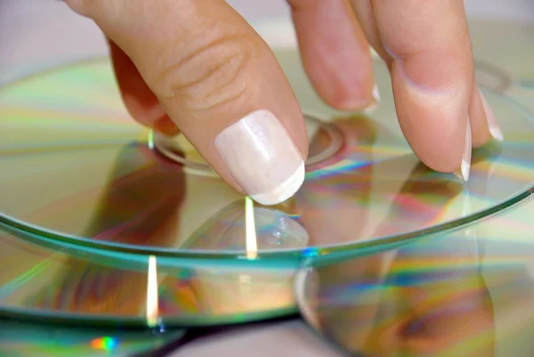 stock image Woman hand over CD