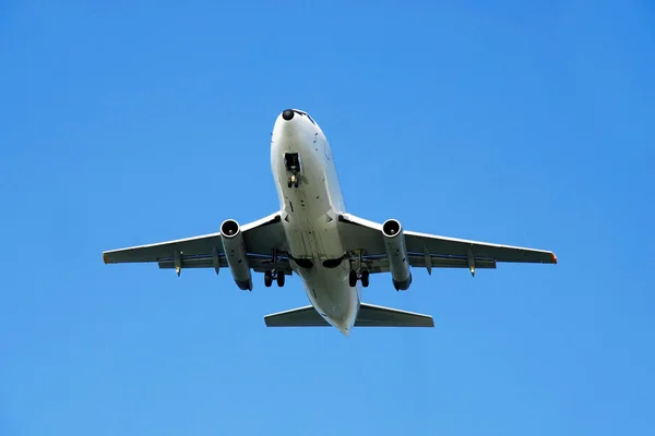 Plane over blue sky — Stock Photo, Image