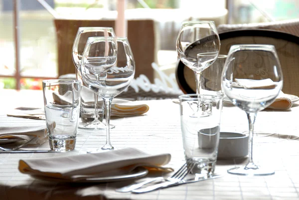 Glasses served on table in restaurant — Stock Photo, Image