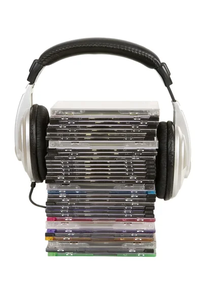 Front view of headphones and cd, dvd — Stock Photo, Image