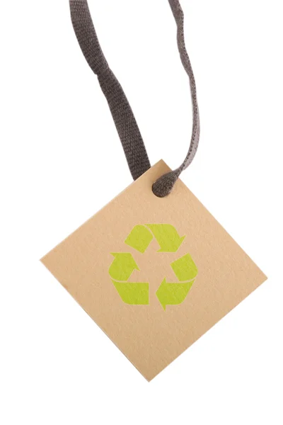 Tan tag and green recycling sign — Stock Photo, Image