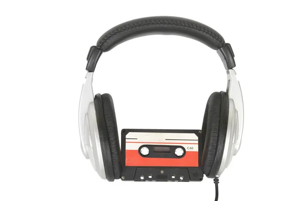 Dj headphones and audio cassette — Stock Photo, Image