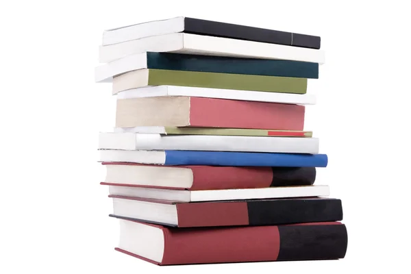Книги с цветной башней расставлены в стопки — стоковое фото