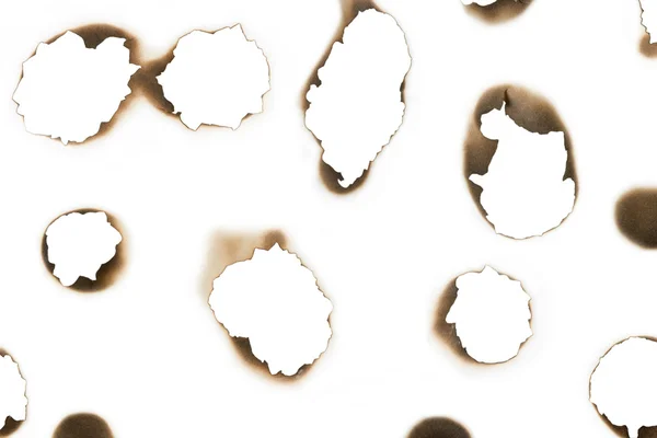 Unterschiedlich verbrannte Formen auf weißem Papier — Stockfoto