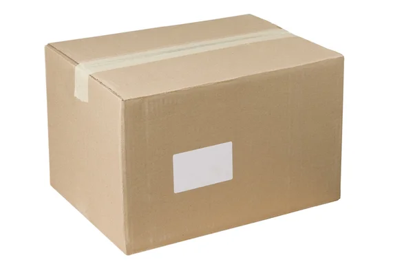 Closed shipping cardboard box whit white empty label — Stock Photo, Image