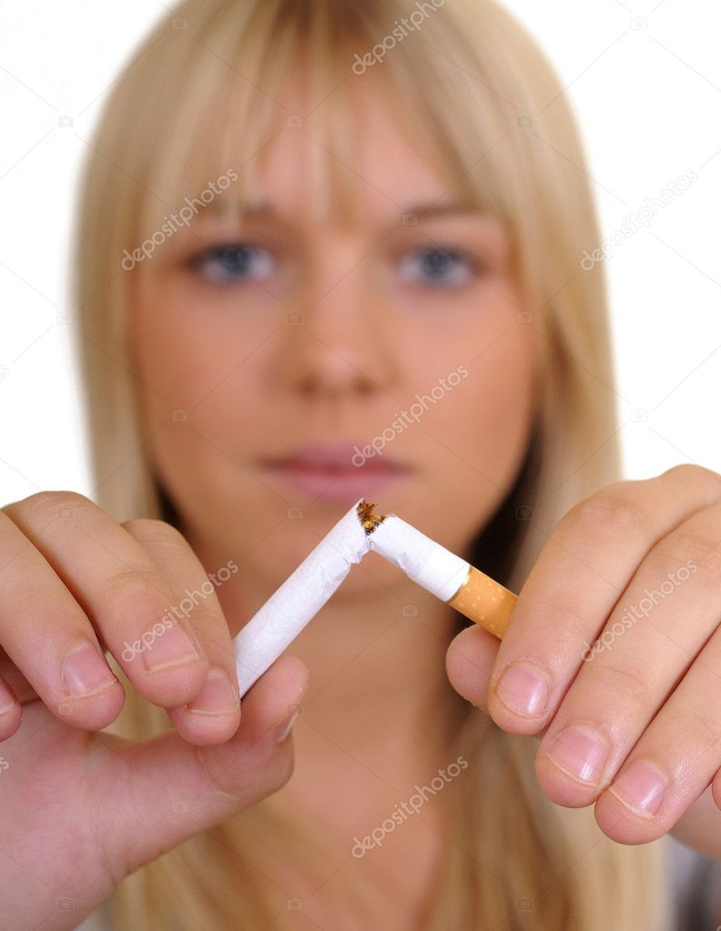 Woman breaks a cigarette