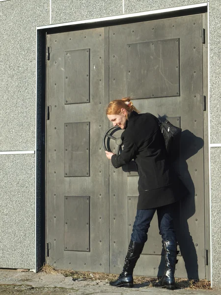 stock image The girl and a door