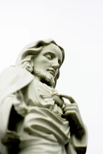 Stone Statue of Jesus Christ in a Cemetery