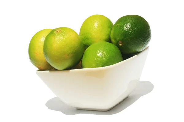 Limes in een kom Stockfoto