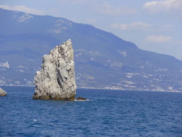Una roca en el mar Imagen De Stock