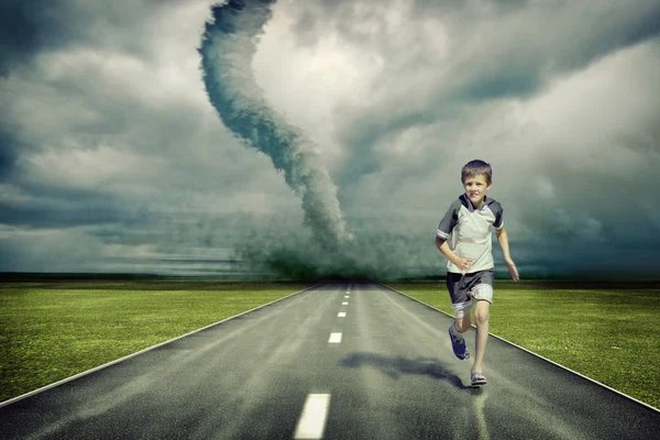 Tornado and running boy — Stock Photo, Image