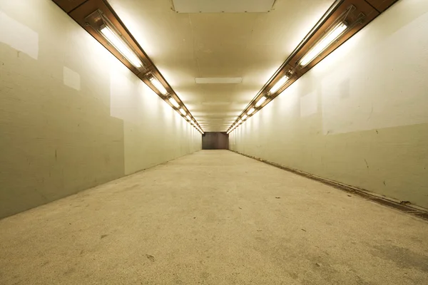 stock image Long tunnel with lamps