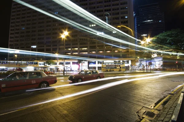 Bus speeding through night street. — Stock Photo, Image