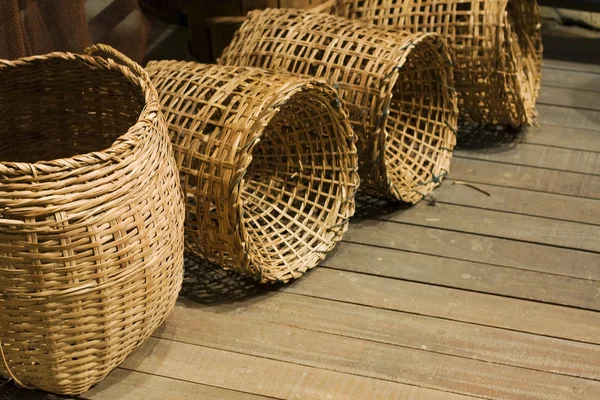 Baskets on wood floor — Stock Photo, Image