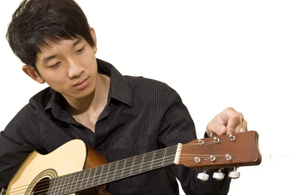 stock image Asia boy plays his guitar