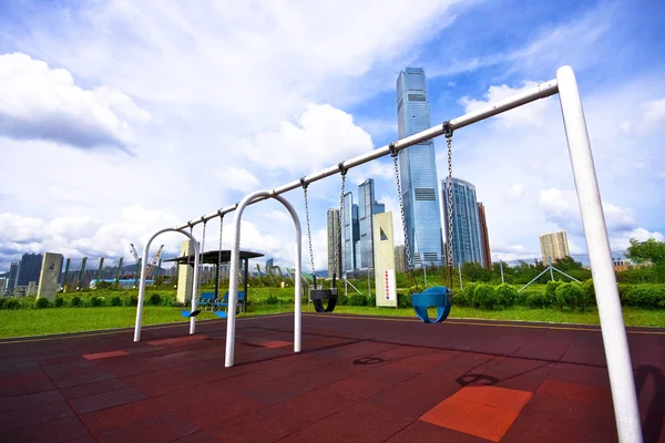 Swing in the park in the city — Stock Photo, Image