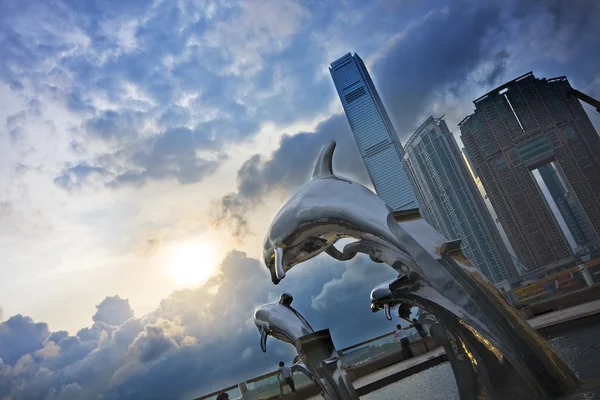 stock image Steel dolphins and beautiful sunset in hong kong