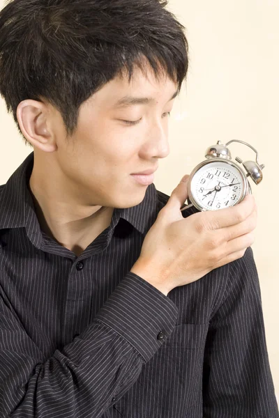 Concept of businessman with a clock on the shoulder