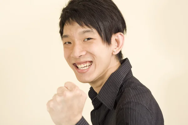 Young Asian man making fight — Stock Photo, Image
