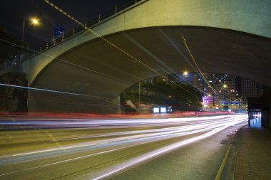 Traffic on the move at night clipart