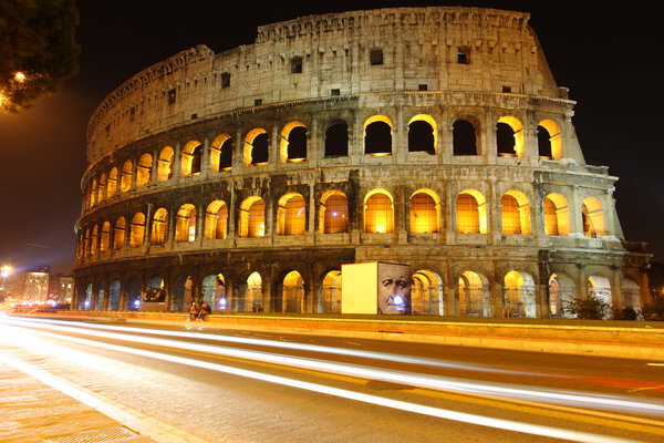 Colosseum in Rome at night - view over street