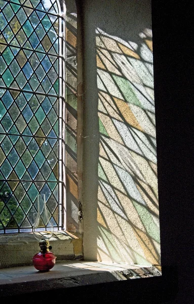 stock image Light shining through a stained glass window