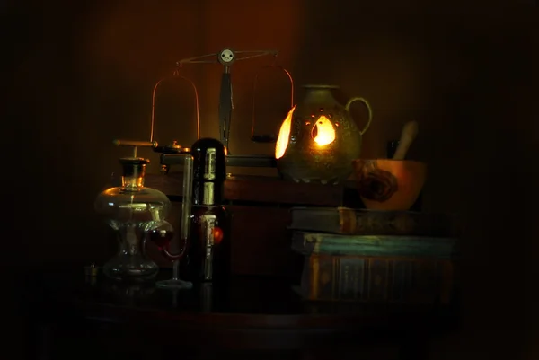 Old pharmacists tools in candle light Stock Photo