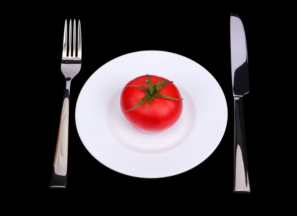 Tomate en plato blanco —  Fotos de Stock