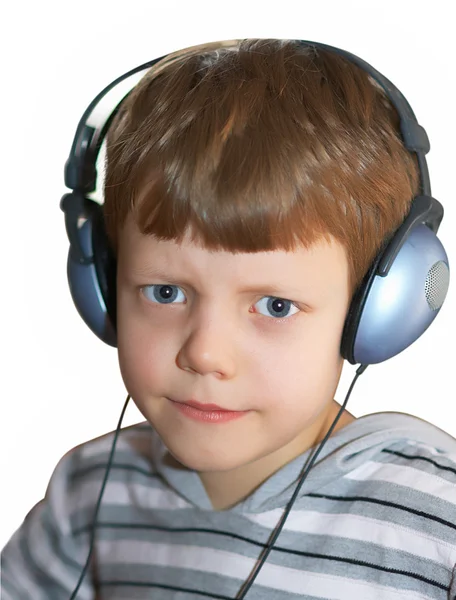 stock image Angry child with earphones isolated on white