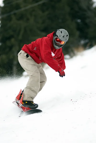 Snowboarder no capacete na corrida — Fotografia de Stock