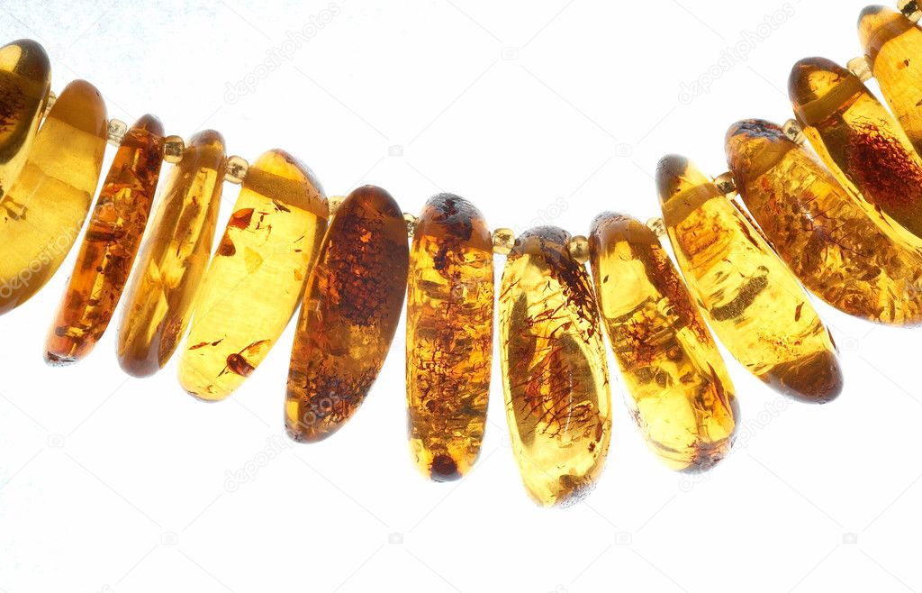 Amber beads isolated on white