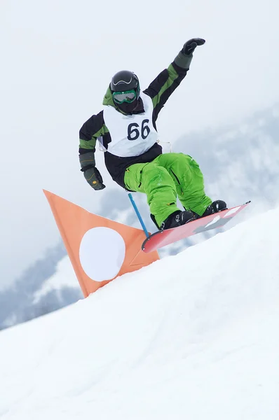 Snowboarder na corrida — Fotografia de Stock