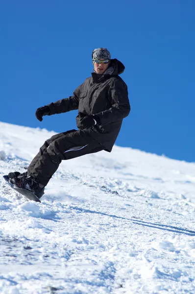 Snowboarder und blauer Himmel lizenzfreie Stockbilder