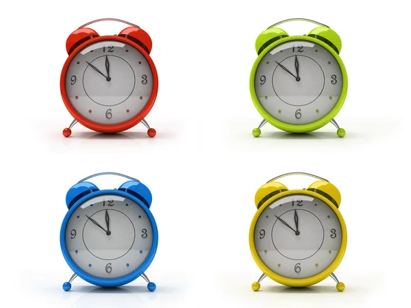Quatro relógios de alarme coloridos — Fotografia de Stock