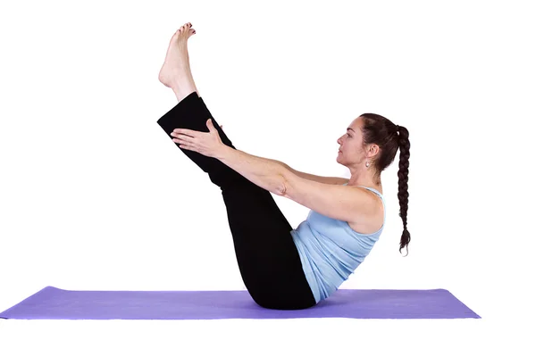 Kvinna i yogaposition Stockbild