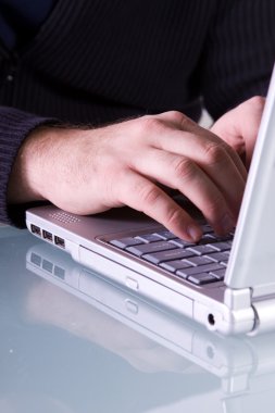 Close up on a man's hands typing clipart