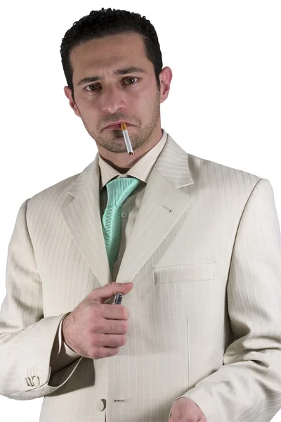 Businessman lighting up a cigarette — Stock Photo, Image