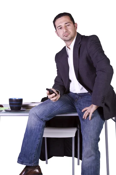 Hombre de negocios sentado en su escritorio — Foto de Stock