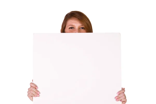 Mujer sosteniendo un signo en blanco — Foto de Stock