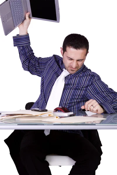 Aufgebrachter Geschäftsmann im Anzug am Schreibtisch — Stockfoto