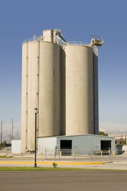 Silo with the Storage Barn in the Front clipart