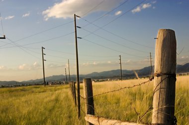 Fence in the Field with Blue Background clipart